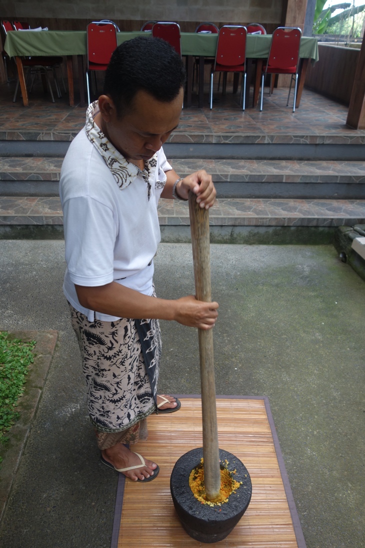 Balinese man grinding